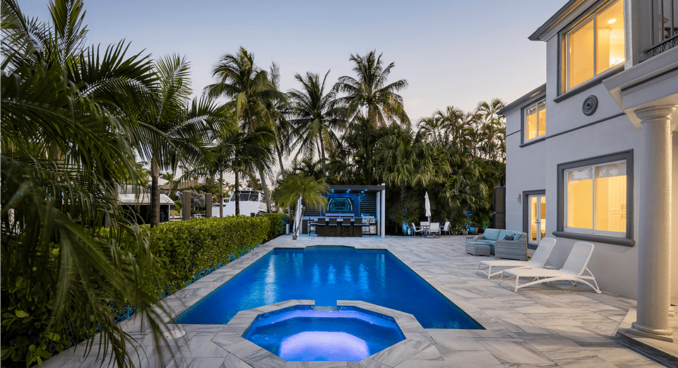 Luxury home with pool and palm trees
